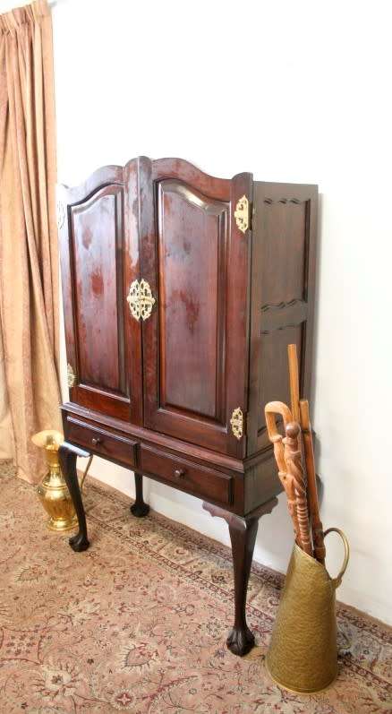 A stunning vintage Imbuia ball & claw drinks cabinet with two drawers, pull out server and shelves