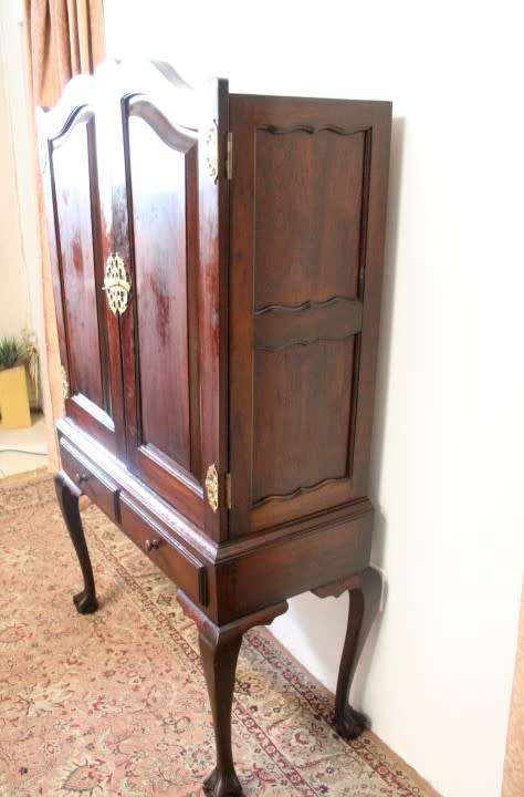 A stunning vintage Imbuia ball & claw drinks cabinet with two drawers, pull out server and shelves