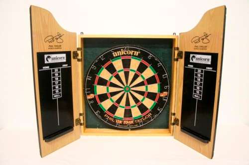 A top quality Unicorn (Phil Taylor)dart board in a wooden cabinet w score boards in super condition.