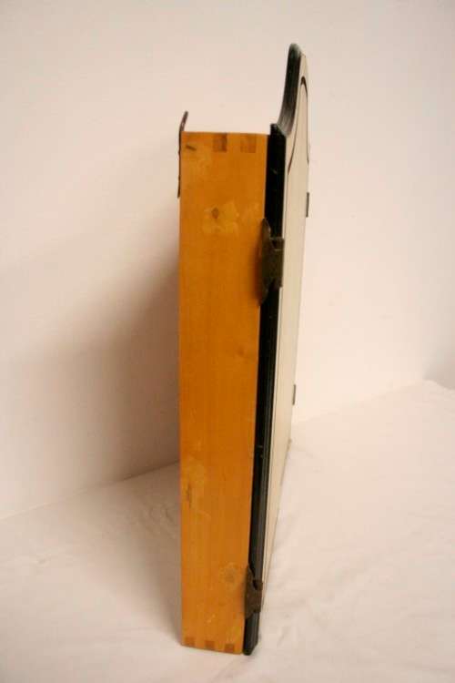 A top quality Unicorn (Phil Taylor)dart board in a wooden cabinet w score boards in super condition.