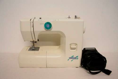 A vintage Janome "Finesse" model JFS1812 sewing machine.