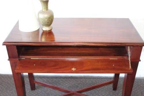 An incredible stylish "Benchmark Wood Classics" one-drawer Mahogany console table w fall-down door
