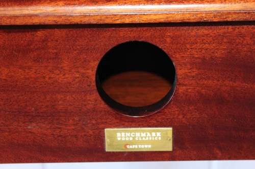 An incredible stylish "Benchmark Wood Classics" one-drawer Mahogany console table w fall-down door