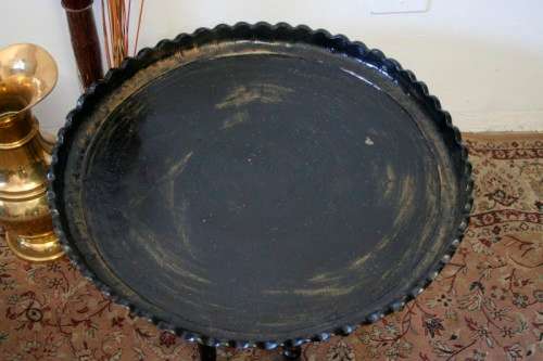 A fabulous Moroccan etched copper tray (w a paint technique) folding table with a wood base.