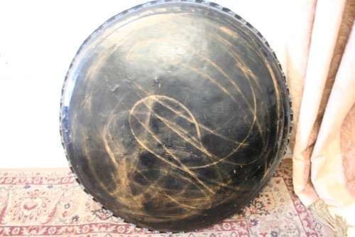 A fabulous Moroccan etched copper tray (w a paint technique) folding table with a wood base.