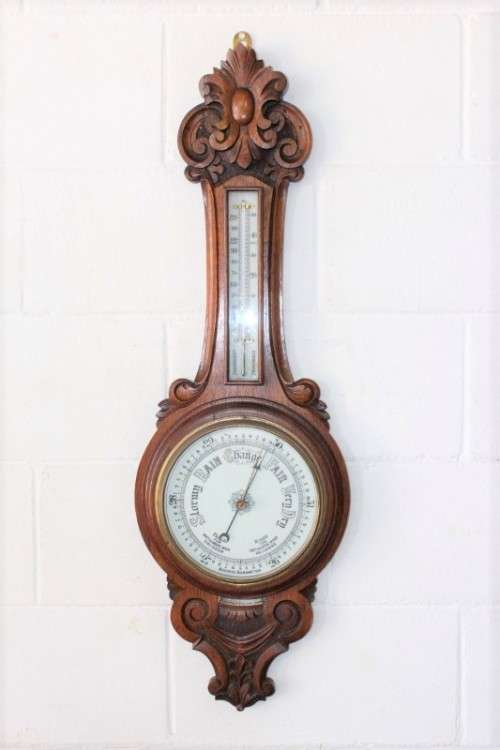 An incredible (large) antique (c1926) hand carved enamel-face wall Barometer and thermometer