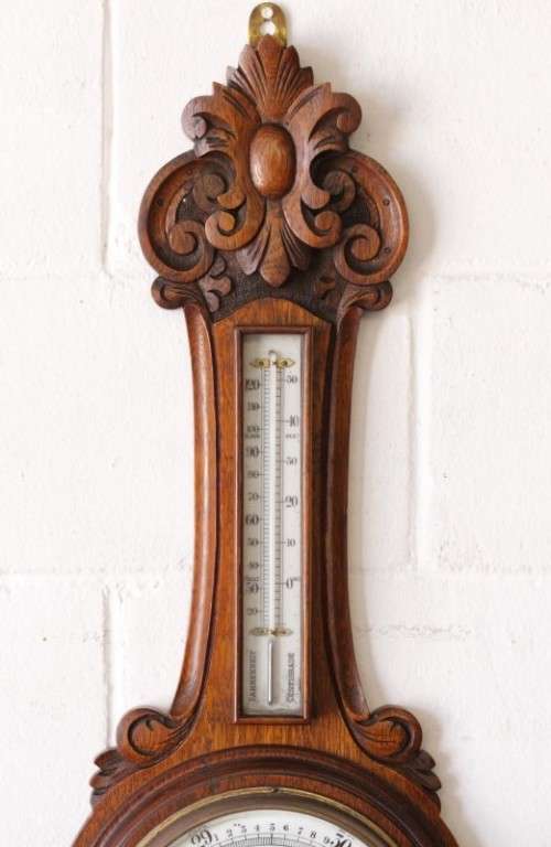 An incredible (large) antique (c1926) hand carved enamel-face wall Barometer and thermometer