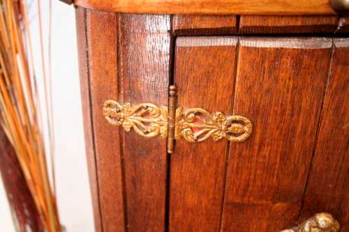 A unique antique Oak drinks trolley cabinet with brass embellishments and original castors.