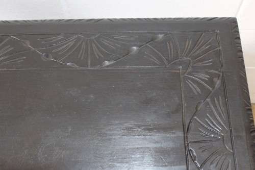 A superb antique hand-carved blackened oak monks bench with a storage chest in the base
