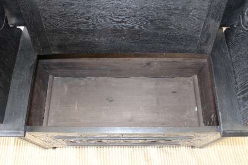 A superb antique hand-carved blackened oak monks bench with a storage chest in the base