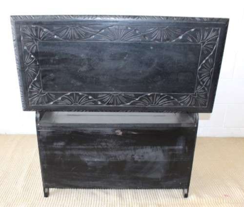 A superb antique hand-carved blackened oak monks bench with a storage chest in the base