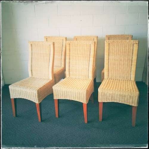 A superb set of six beautifully made hi-back wicker and mahogany dining chairs in great condition