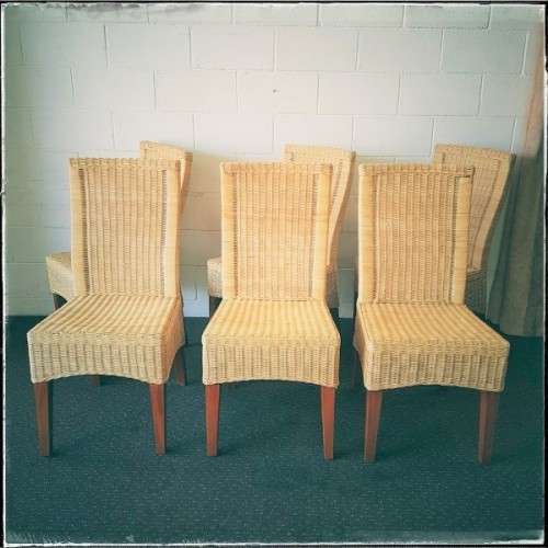 A superb set of six beautifully made hi-back wicker and mahogany dining chairs in great condition