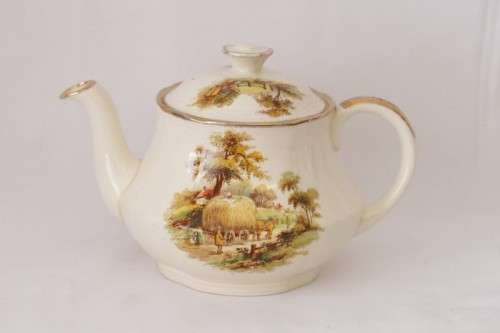 A gorgeous vintage Alfred Meakin ivory-porcelain 4-cup teapot with beautiful country scene detailing
