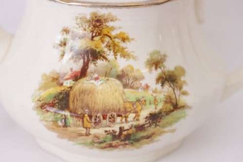 A gorgeous vintage Alfred Meakin ivory-porcelain 4-cup teapot with beautiful country scene detailing