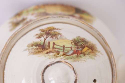 A gorgeous vintage Alfred Meakin ivory-porcelain 4-cup teapot with beautiful country scene detailing