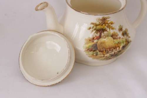 A gorgeous vintage Alfred Meakin ivory-porcelain 4-cup teapot with beautiful country scene detailing