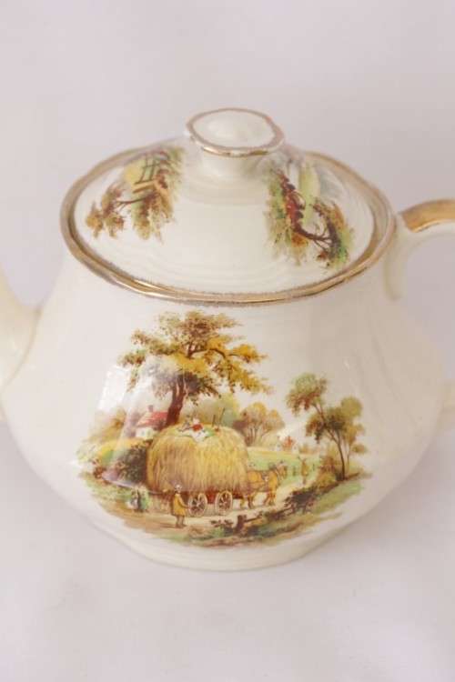 A gorgeous vintage Alfred Meakin ivory-porcelain 4-cup teapot with beautiful country scene detailing
