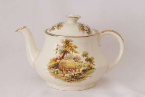 A gorgeous vintage Alfred Meakin ivory-porcelain 4-cup teapot with beautiful country scene detailing