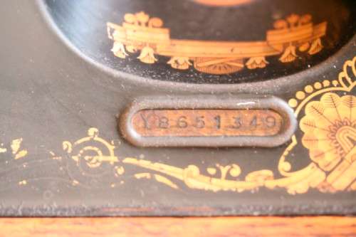 A spectacular 1933 Singer treadle sewing machine in its original Oak cabinet in wonderful condition