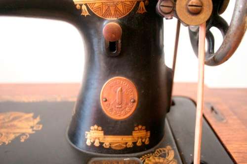 A spectacular 1933 Singer treadle sewing machine in its original Oak cabinet in wonderful condition
