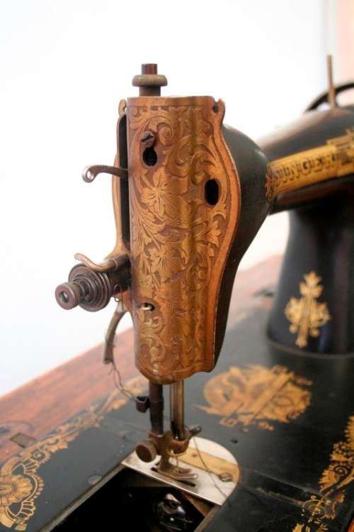 A spectacular 1933 Singer treadle sewing machine in its original Oak cabinet in wonderful condition