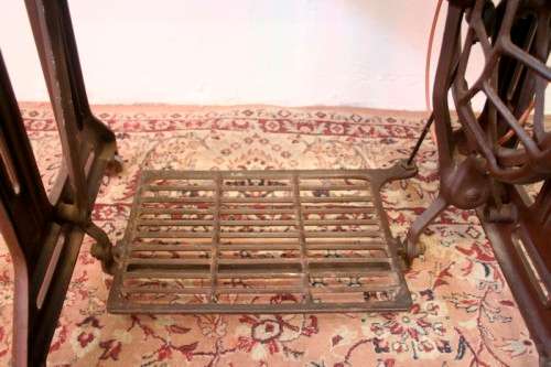 A spectacular 1933 Singer treadle sewing machine in its original Oak cabinet in wonderful condition