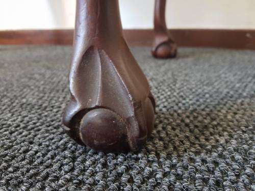 A beautiful and elegant vintage solid imbuia piano stool/ bench with carved ball and claw feet.