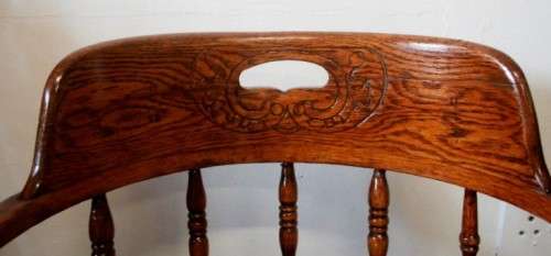 A superb antique oak captains swivel desk chair with a rattan seat in very good condition.