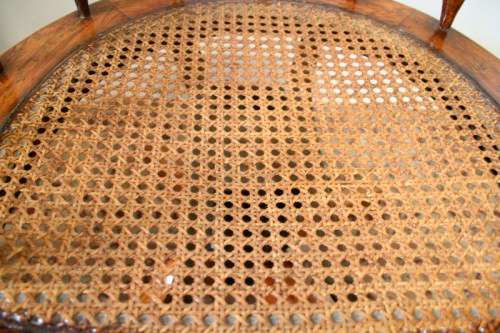 A superb antique oak captains swivel desk chair with a rattan seat in very good condition.