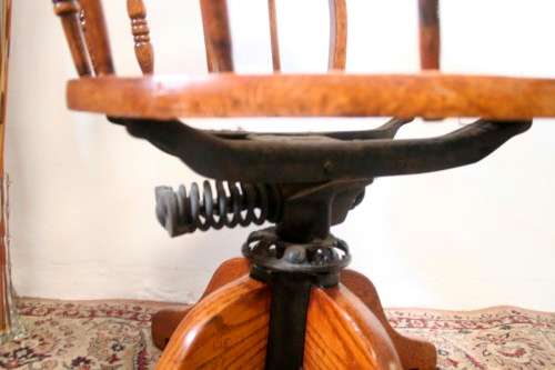 A superb antique oak captains swivel desk chair with a rattan seat in very good condition.