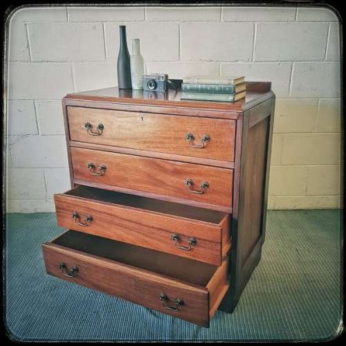 A beautiful vintage Teak 4-drawer chest of drawers w/ gorgeous period style handles