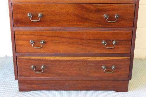 A beautiful vintage Teak 4-drawer chest of drawers w/ gorgeous period style handles