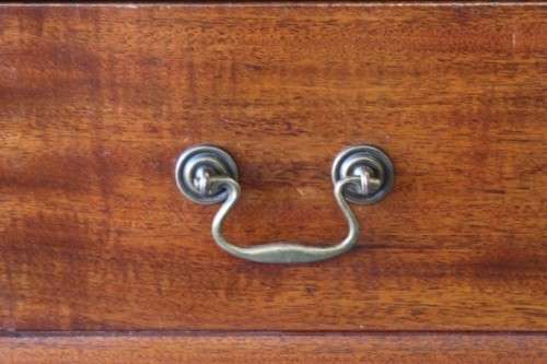 A beautiful vintage Teak 4-drawer chest of drawers w/ gorgeous period style handles