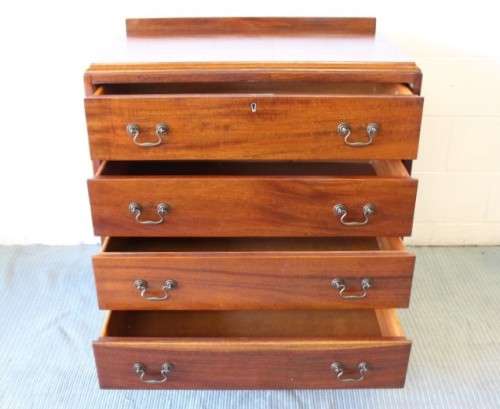 A beautiful vintage Teak 4-drawer chest of drawers w/ gorgeous period style handles