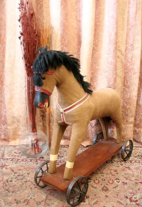 A stunning RARE antique pull toy horse on wheels in good condition - wow!!