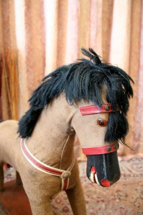 A stunning RARE antique pull toy horse on wheels in good condition - wow!!