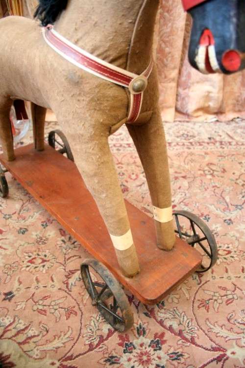 A stunning RARE antique pull toy horse on wheels in good condition - wow!!