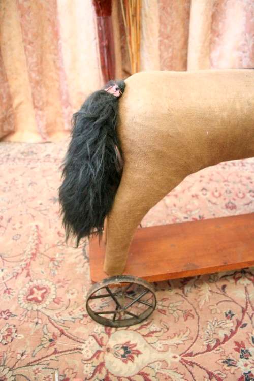 A stunning RARE antique pull toy horse on wheels in good condition - wow!!