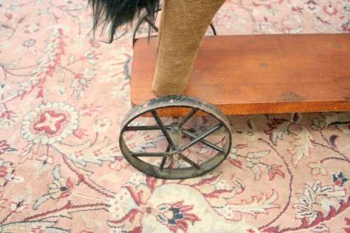A stunning RARE antique pull toy horse on wheels in good condition - wow!!
