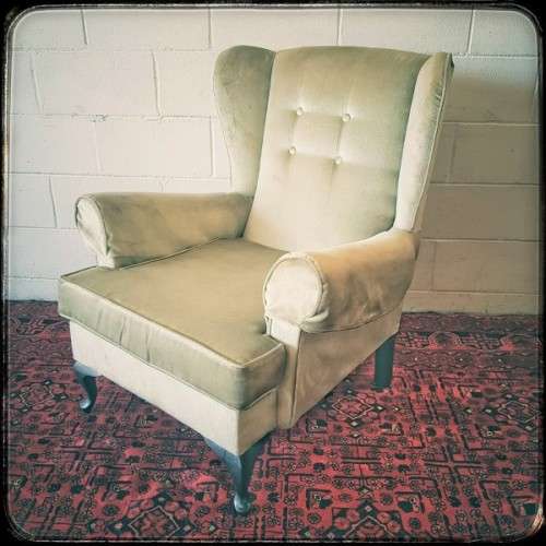An awesome Queen Anne button-back wing-back armchair in a pale green velvet with arm covers