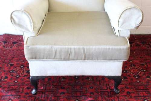 An awesome Queen Anne button-back wing-back armchair in a pale green velvet with arm covers