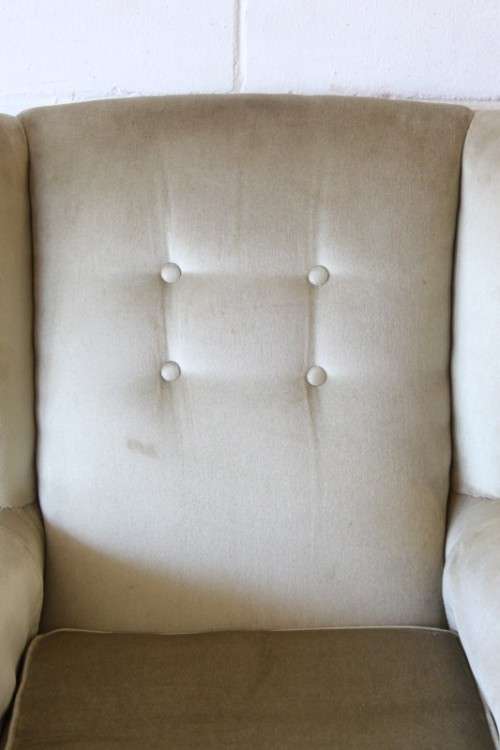An awesome Queen Anne button-back wing-back armchair in a pale green velvet with arm covers