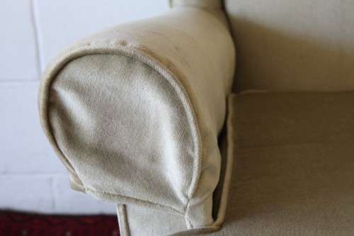 An awesome Queen Anne button-back wing-back armchair in a pale green velvet with arm covers