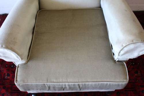 An awesome Queen Anne button-back wing-back armchair in a pale green velvet with arm covers