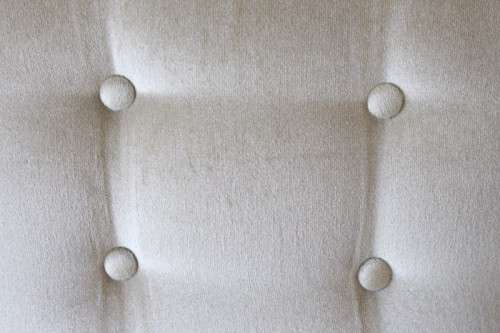 An awesome Queen Anne button-back wing-back armchair in a pale green velvet with arm covers