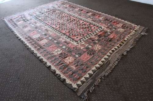**RS17** A traditional Turkish Kilim carpet w/ beautiful motifs in rust, ivory, black & earthy hues