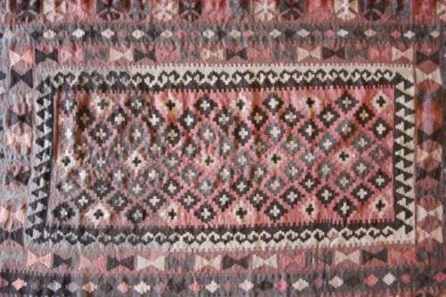 **RS17** A traditional Turkish Kilim carpet w/ beautiful motifs in rust, ivory, black & earthy hues