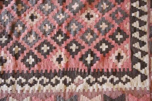 **RS17** A traditional Turkish Kilim carpet w/ beautiful motifs in rust, ivory, black & earthy hues