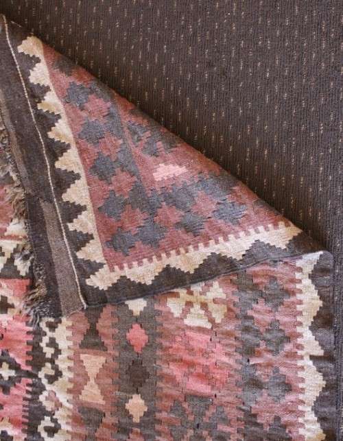 **RS17** A traditional Turkish Kilim carpet w/ beautiful motifs in rust, ivory, black & earthy hues